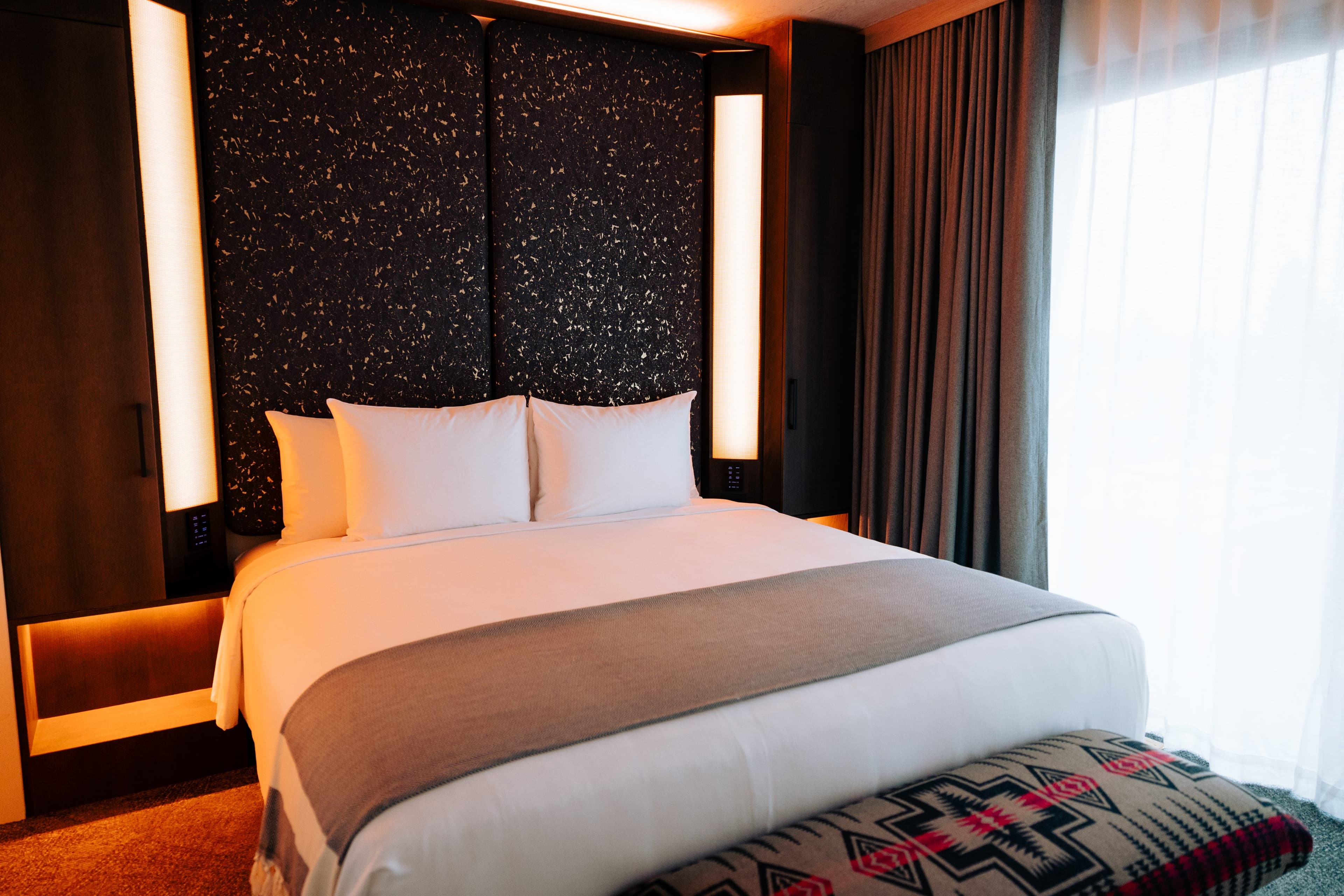 A CASCADA bedroom dressed with natural-material bedding