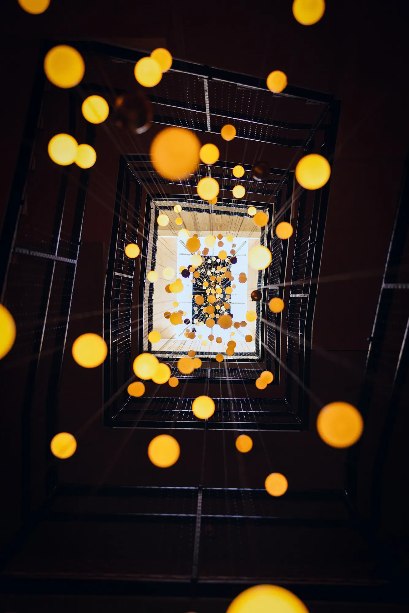 Glowing sculptural lights within CASCADA’s architecture