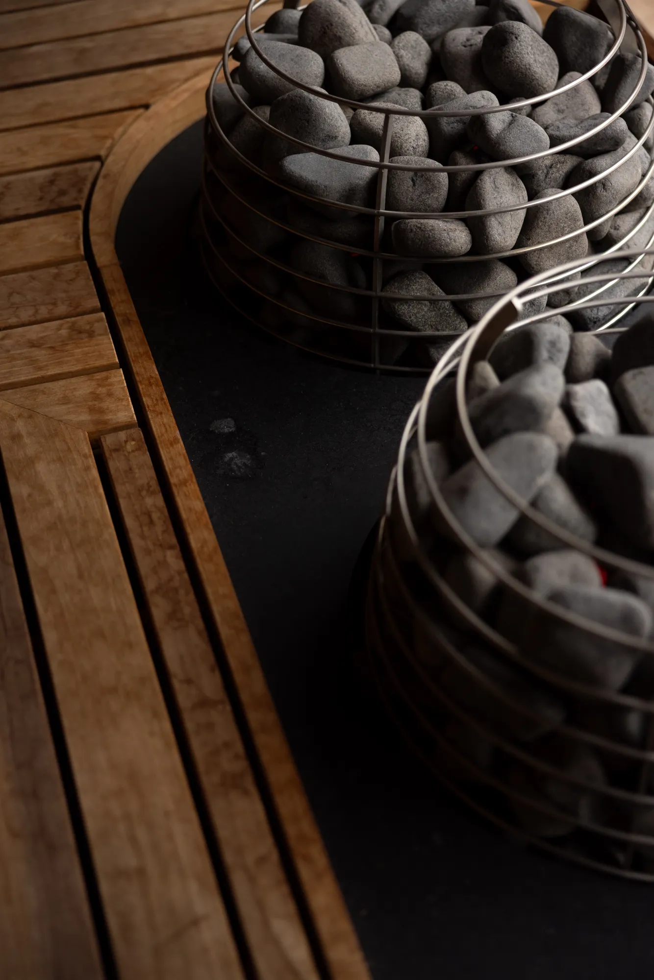 Warm timber and curved seating inside the sauna